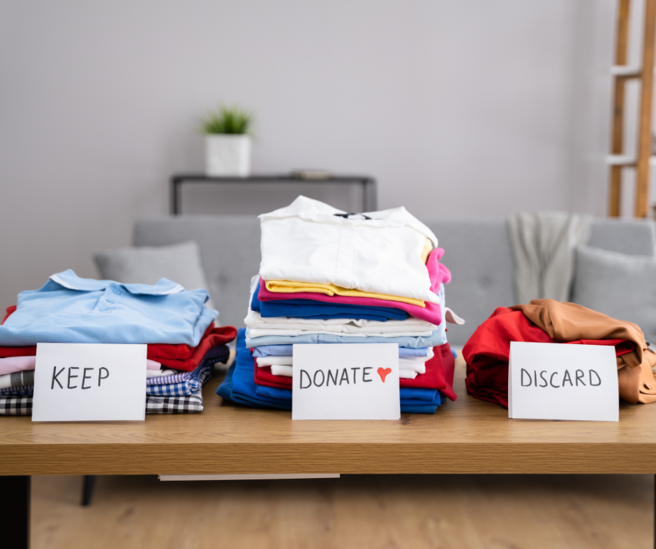 An image of three different piles of clothing, labeled "Keep," "Donate," and "Discard." Demonstrating that fall decluttering for a fresh start is very important.